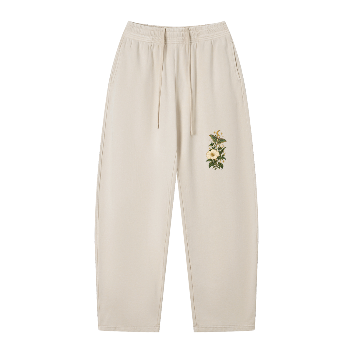EvoCore Moonflower Motel Washed Sweatpants in Apricot, front view showing pale flowers, green moth and crescent moon on the front thigh.