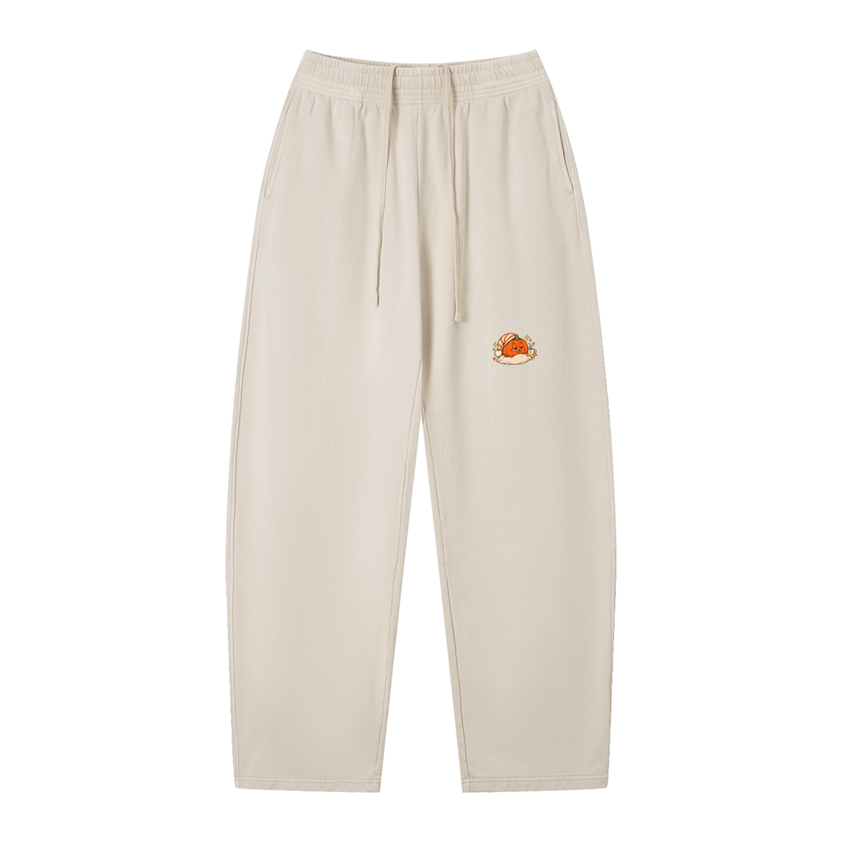 EvoCore Pumpkin Pause Washed Sweatpants in Apricot, front view with a sleepy orange pumpkin resting on a pillow at the thigh.