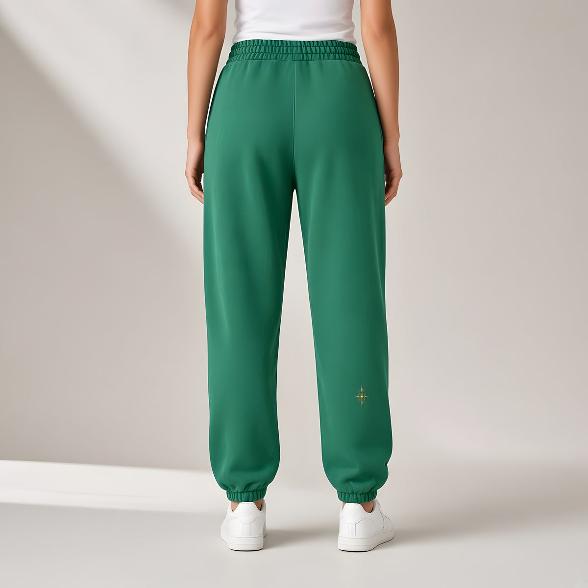 Back view of the Dark Green EvoCore Chrome Venom Greenwire Joggers showing the back leg print, stone-grey studio.
