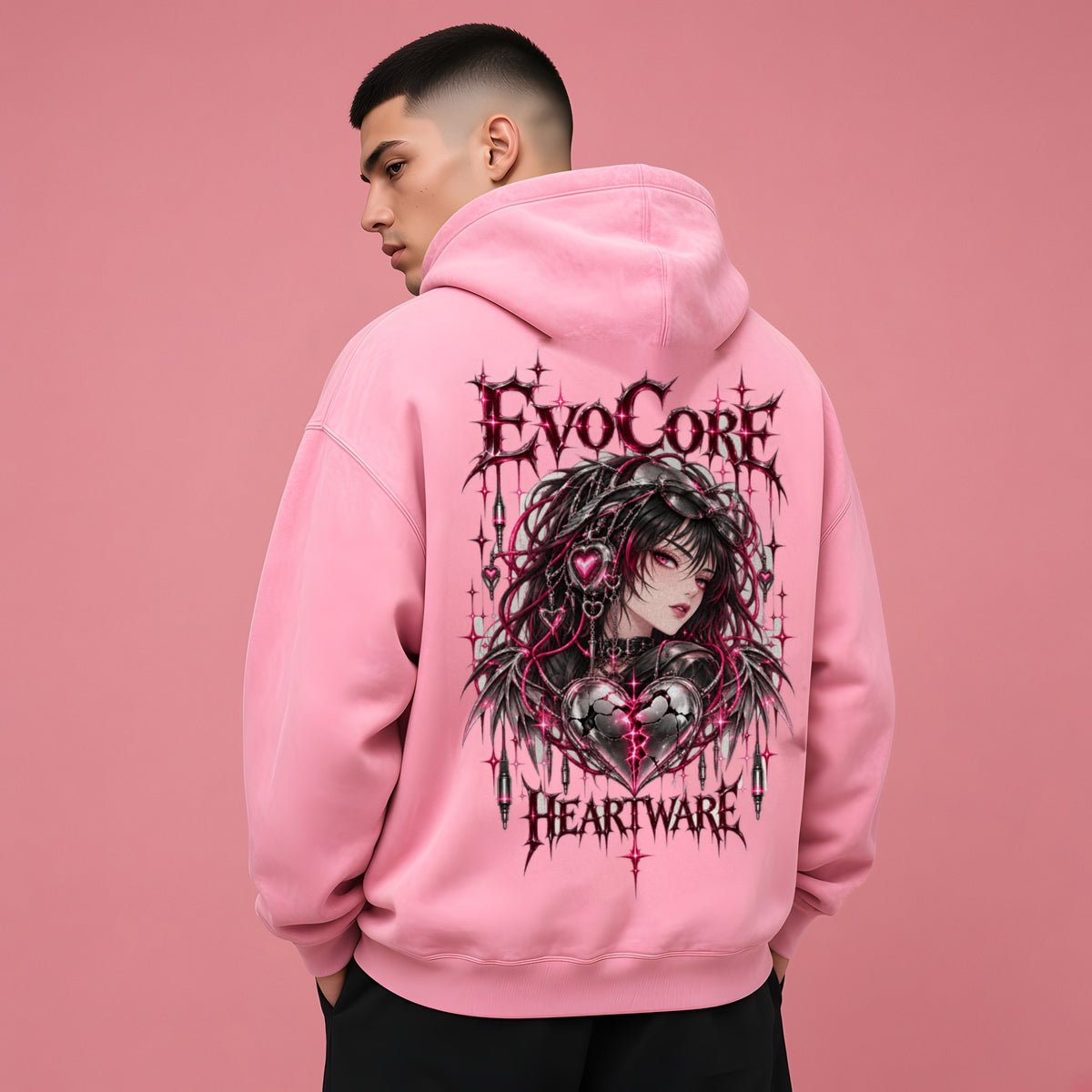 EvoCore Heartware Rose Circuit Hoodie in Pink, back view worn by a model, pink studio backdrop