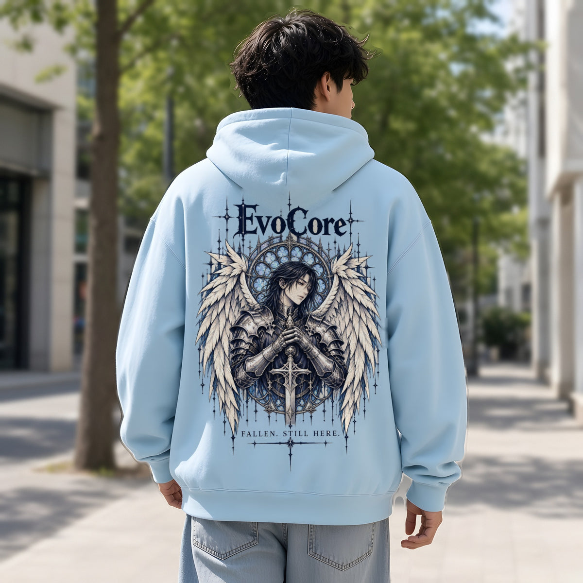 EvoCore Seraph Bluehour Hoodie in Lake Blue, back view worn by a model, daytime city sidewalk