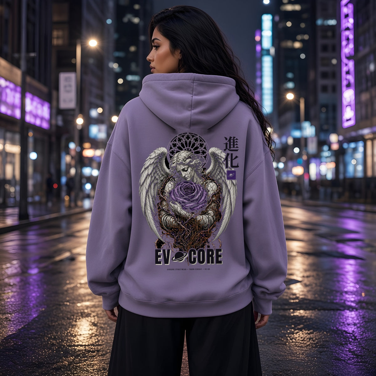 Back view of the EvoCore Thorn Circuit Hoodie in washed lavender on a wet city street at night, showing the stone angel holding a violet rose wrapped in circuit thorns, with 進化 kanji and EVOCORE wordmark